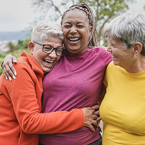 5-laughmore-adobestock_426685376_300x300 Adults embracing during community gathering